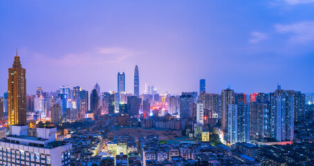Skyline scenery of high-rise buildings at night in Luohu District, Shenzhen, China