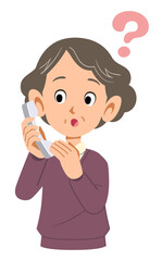 電話の応対に疑問を持つシニアの女性
