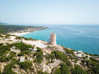 Aerial view of a 16th century tower converted into lighthouse in Bolonia, Spain.