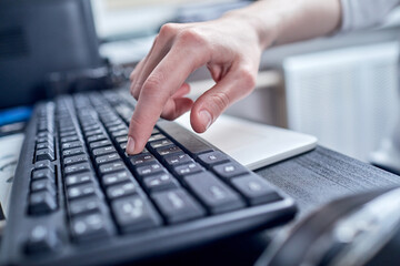 Fototapeta na wymiar Female hands or woman office worker typing on the keyboard