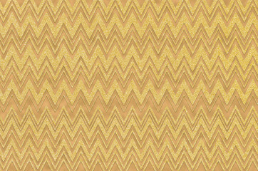 Abstract textured design of gold zigzag against a gold glitter background.