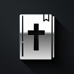 Silver Holy bible book icon isolated on black background. Long shadow style. Vector.