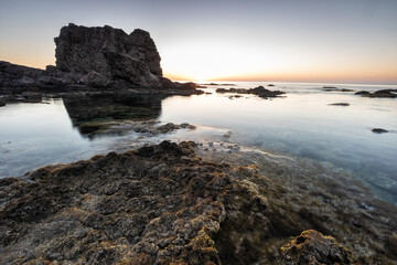Fototapeta na wymiar Sunrise on the coast of Escullos. Natural Park of Cabo de Gata. Almeria. Spain.