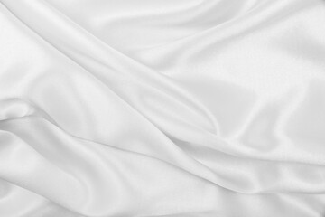 Smooth elegant white silk or satin luxury cloth texture as wedding background. Luxurious background design