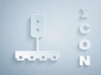 Paper cut Train traffic light icon isolated on grey background. Traffic lights for the railway to regulate the movement of trains. Paper art style. Vector.