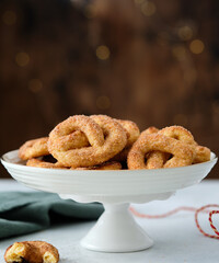 Pretzel cookies with sugar on a Christmas background. Sugar cookies.
