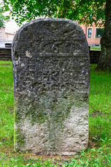Old memorial stone in a park in Falköping, Sweden