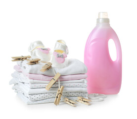 Fresh baby laundry and bottle of detergent on white background