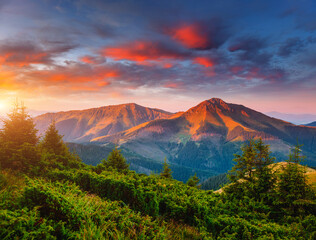Exotic landscape in the mountains at sunset. Picture of colorful cloudy sky.