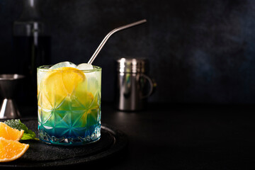 blue curacao cocktail with orange juice and orange slices