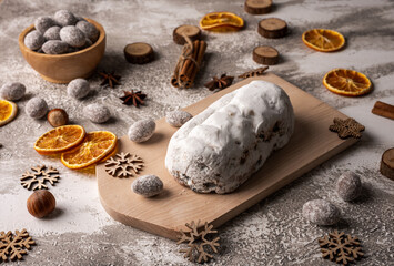 Traditional Christmas holiday cake - stollen with dried fruits and nuts. Concept for postcard, holiday greeting.