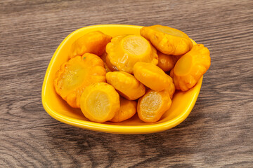 Marinated yellow patisson in the bowl