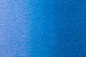 Abstract art background navy blue colors. Watercolor painting on canvas with soft denim gradient.