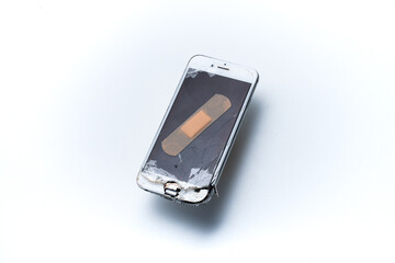 smartphone with broken screen on white background. smartphone to be repaired. mobile phone...
