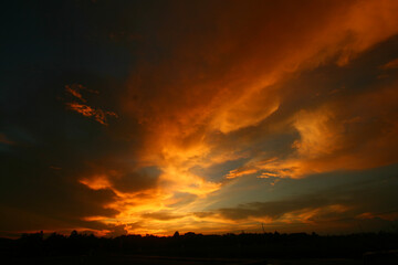 Fototapeta na wymiar Twilight with orange clouds and blue sky