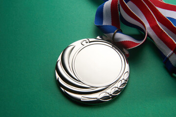 silver medal on the green background