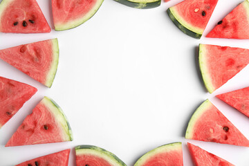 Frame made with slices of ripe watermelon on white background, flat lay. Space for text