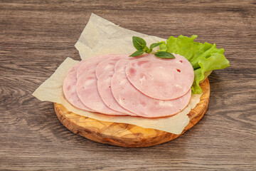 Slised ham snack over board