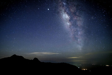 Amazing stary night above the mountain range in Doi Luang National Park, Thailand.