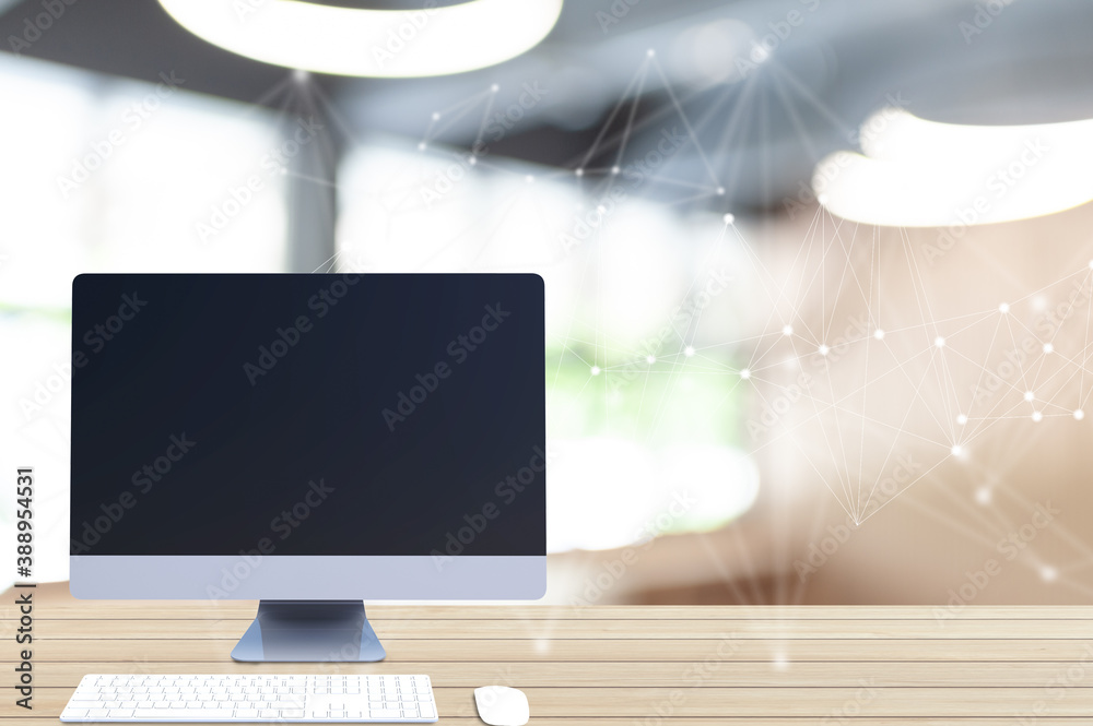 Poster Computer with a blank screen on a desk in an office or studio The concept of working with the world of technology