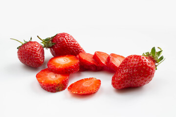 Sliced strawberries on white background