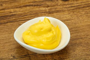 Natural cheese sauce in the bowl