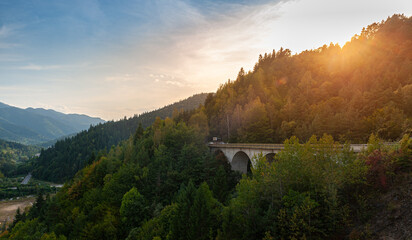 Summer spectacular sunset with vivid colors over Izvorul Muntelui (Mountain Spring) Lake next to Bicaz in Romania
