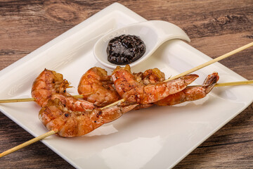 Grilled prawn skewer with pepper sauce