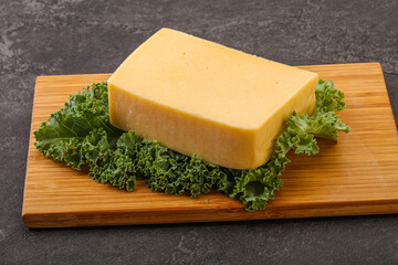 Tasty yelloow Tilsiter cheese brick