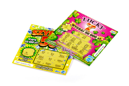 Two scratch off Polish lottery tickets. Gambling, winning money, two lottery paper coupons, tickets, scratchies, scratch cards isolated on white