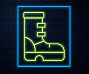 Glowing neon line Waterproof rubber boot icon isolated on brick wall background. Gumboots for rainy weather, fishing, gardening. Vector.
