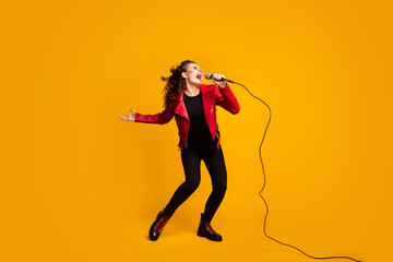 Fototapeta na wymiar Full length body size view of attractive cheery wavy-haired girl solo vocalist singing hit stereo isolated on bright yellow color background