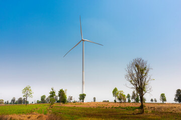 Fototapeta premium Wind turbines for electric power production. Green ecological power energy generation.