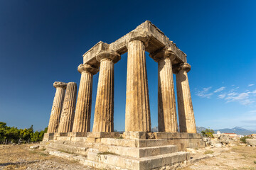 Ruins of the Temple of Apollo in Ancient Corinth, Peloponnese, Greece. For Christians, Corinth is...