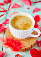 cup of coffee and hearts on light surface