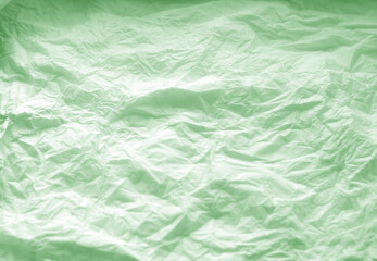 Crumpled paper background in green.