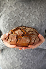 Woman's hands holding bread