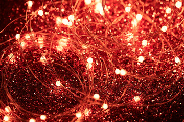 Led lights close up. Beautiful red Christmas and New Year garland is glowing.