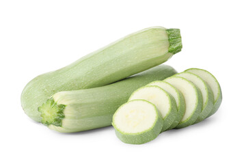 Cut and whole green ripe zucchinis on white background