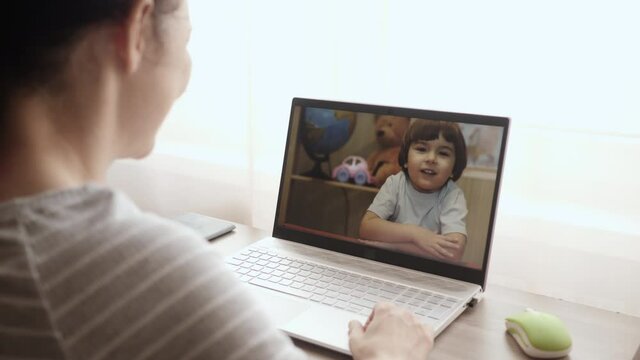 Video Call. Distance Education. Little Child Video Call Via Laptop Talking to Mom. Online Tutor, Mother, Pediatrician Talking With Kid Video Calling Using Computer. Home Conference Children Education.