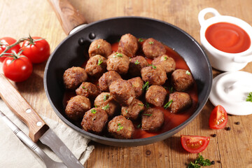 fried meatball and tomato sauce