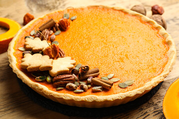 Delicious homemade pumpkin pie on wooden table, closeup