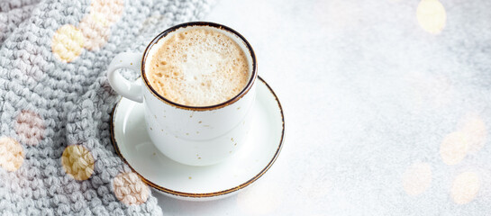 Cup of coffee, scarf and garland. Cozy autumn or winter composition. Scandinavian style