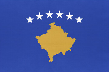 Republic of Kosovo national fabric flag, textile background. Symbol of international world European country.