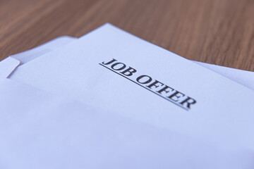 White envelope, containing job offer letter