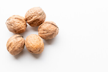 close up of walnut wood grain in autumn season in brown color isolated on white background with space for texting.
