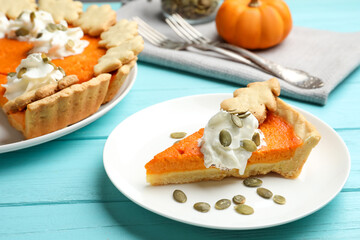 Delicious homemade pumpkin pie on light blue wooden table