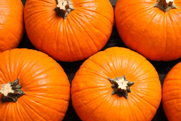 Many ripe orange pumpkins on table, flat lay