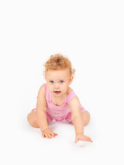 little girl with curly hair on a light background