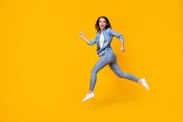 Fototapeta na wymiar Full length body size profile side view of her she nice attractive cheerful cheery girl jumping running fast black friday discount isolated bright vivid shine vibrant yellow color background